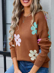 Brown crewneck sweater with colorful floral print, acrylic knit, long sleeves, ribbed cuffs and hem.