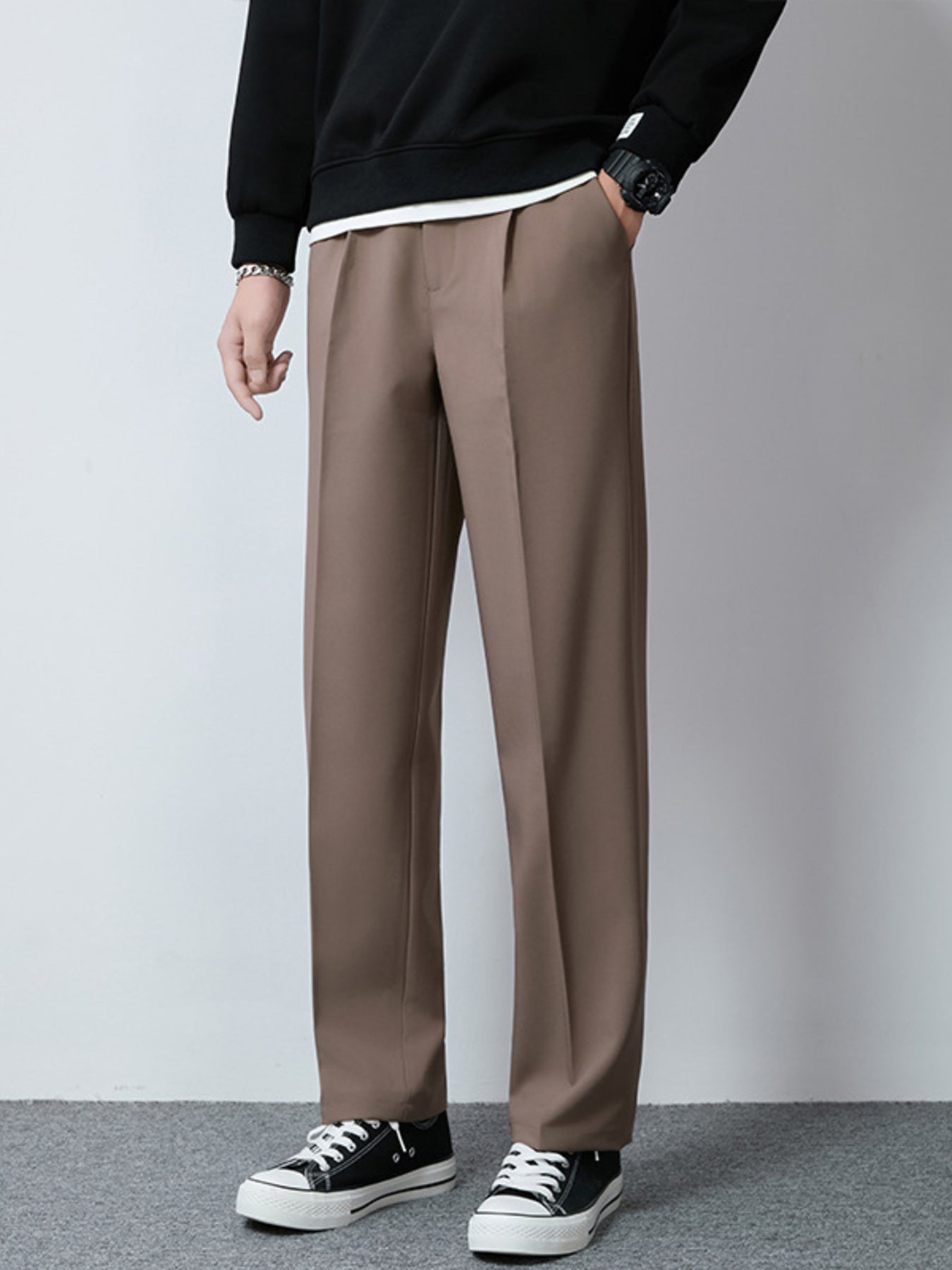 Men's brown wide-leg casual pants with a relaxed fit and clean front.