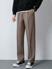 Men's brown wide-leg casual pants with a relaxed fit and clean front.