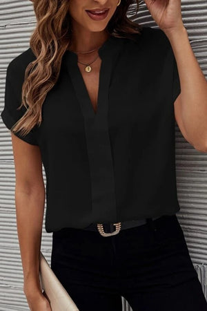 Black plunge front blouse with cuffed short sleeves and a V-neckline.