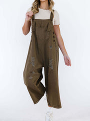 Ripped relaxed fit brown denim overalls with adjustable straps and button details.