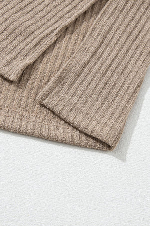 Khaki ribbed knit henley top with button detail and relaxed fit.
