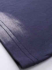 Men's dark navy t-shirt with abstract brushstroke detail and visible stitching.