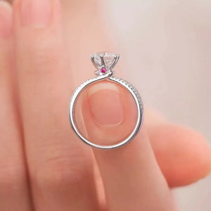 Sterling silver ring with moissanite diamond and small pink accent stone
