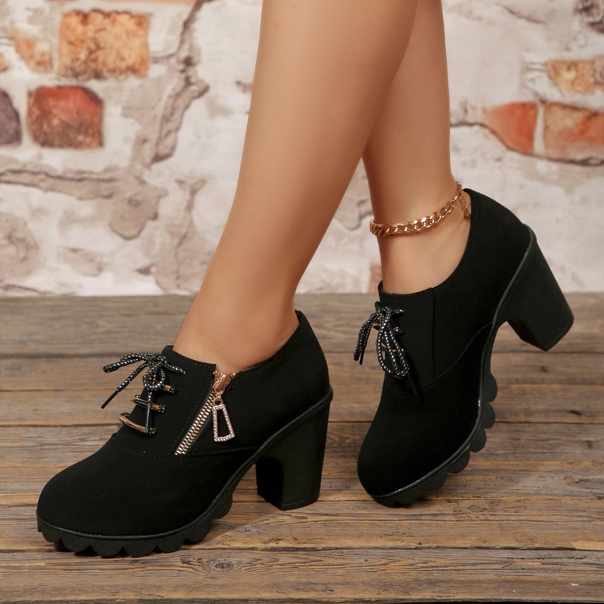 Black lace-up high heel pumps with a side zipper and chunky block heel.