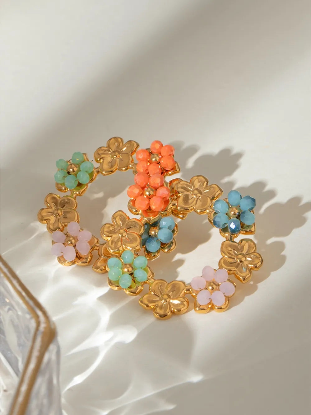 Gold floral halo beaded statement earrings with colorful crystal flowers