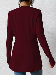 Wine red single-button blazer with tailored fit and long sleeves.