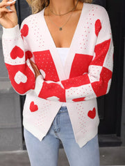White and red heart print acrylic cardigan with a V-neck and long sleeves.