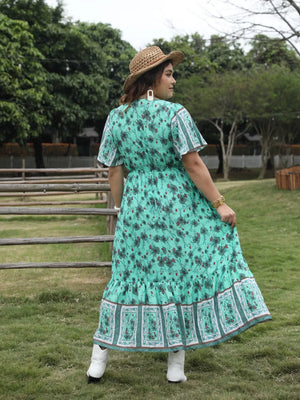 Maxi dress with floral print, square neck, short sleeves, and tiered hem.