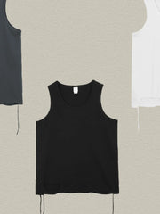 Black raw edge scoop neck tank top with distressed hem detail