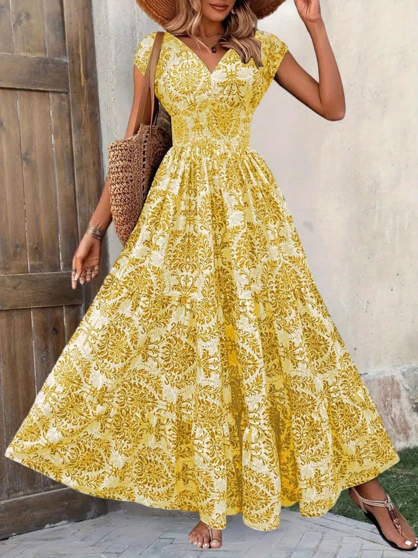Yellow damask print maxi dress with cap sleeves and V-neck, cinched waist, tiered skirt.