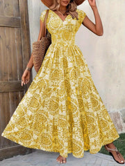 Yellow damask print maxi dress with cap sleeves and V-neck, cinched waist, tiered skirt.