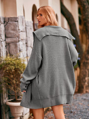 Grey hooded knit cocoon cardigan with oversized collar and pockets.