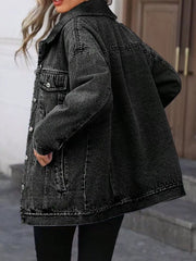Oversized washed grey denim jacket with button pockets and collar.