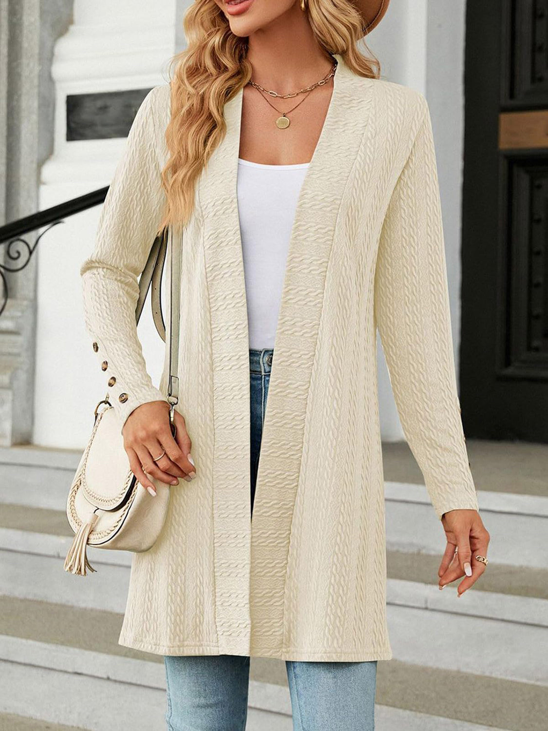 Textured knit longline cardigan in tan with button details on the sleeves.