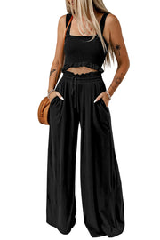 Black smocked crop top with ruffled hem and wide leg lounge pants with drawstring waist and pockets