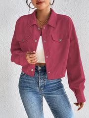 Cropped corduroy jacket in cerise with snap front and chest pockets.