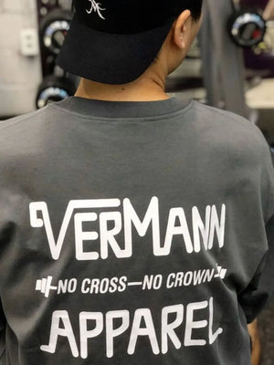 Dark gray oversized graphic tee with white "VERMANN APPAREL NO CROSS-NO CROWN" text on back.