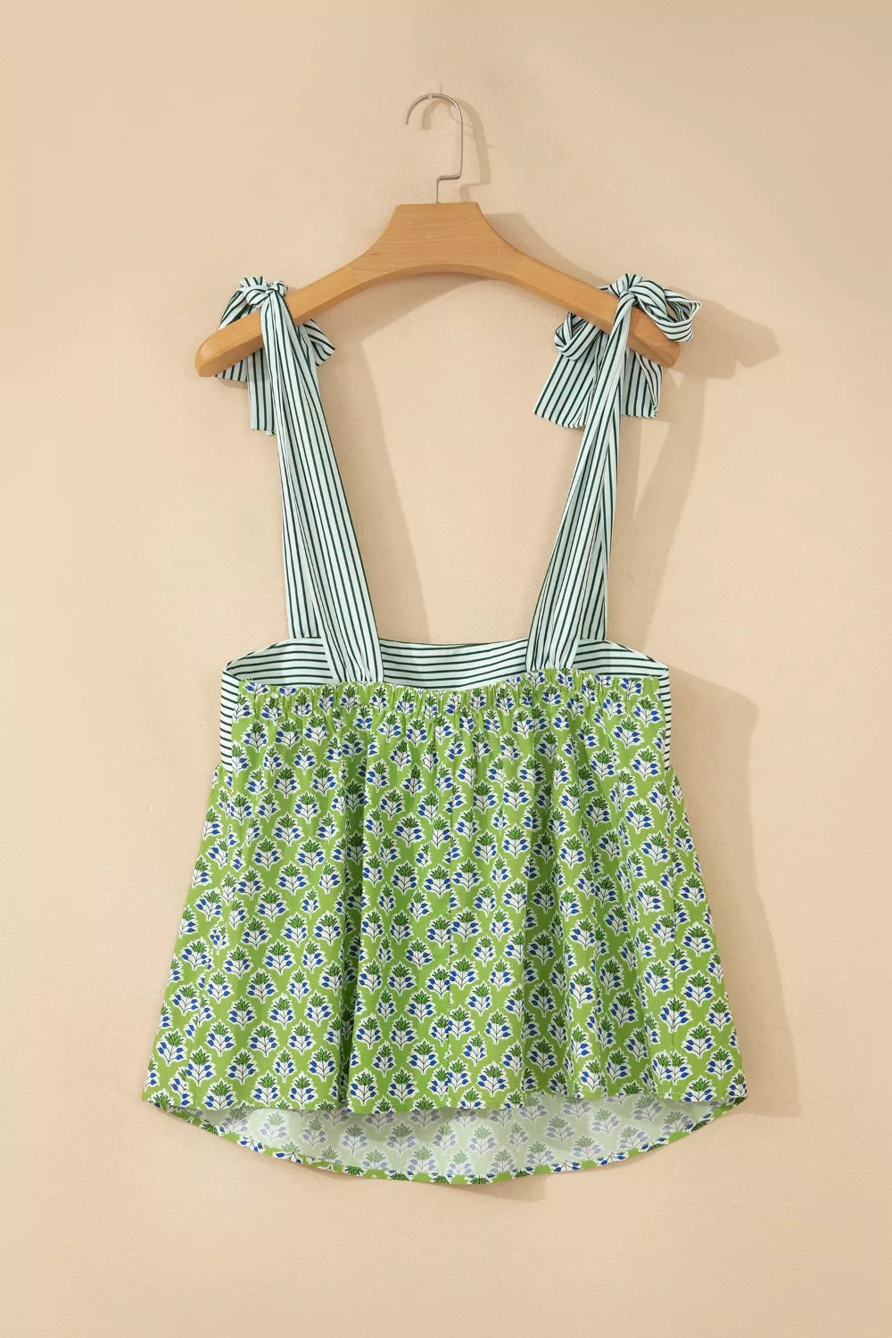 Floral tie-strap tank top with square neckline and green stripe straps.
