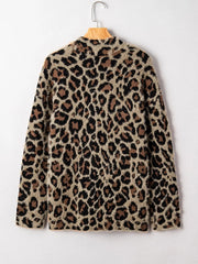 Leopard print fuzzy cardigan with pockets and side slits.