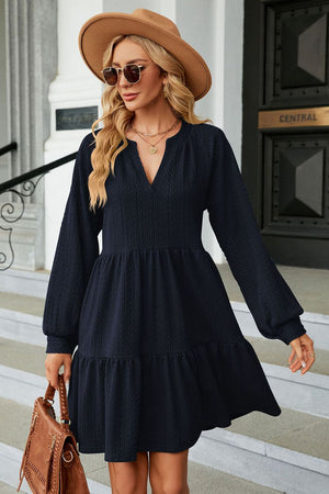 Dark Blue textured babydoll mini dress with voluminous sleeves and tiered hem.