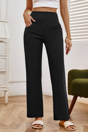 Black high-waisted flare leg trousers with pockets