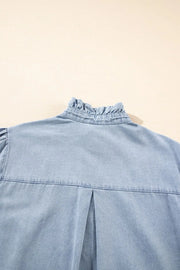 Light blue denim blouse with ruffled collar and puff sleeves.