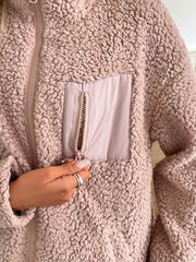 Teddy fleece jacket in watermelon pink with zippered patch pocket and full zip closure.