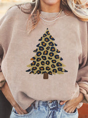 Eggshell corded sweatshirt with leopard print Christmas tree graphic.