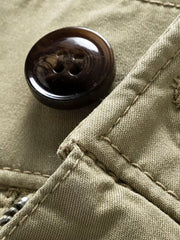 Army green cargo joggers with flap pocket detail and button closure.