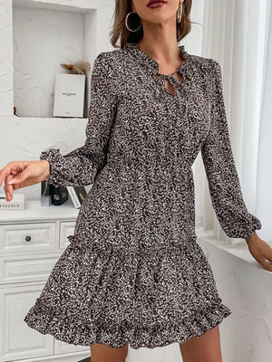 Dark brown floral mini dress with ruffled tie neck and tiered ruffled hem