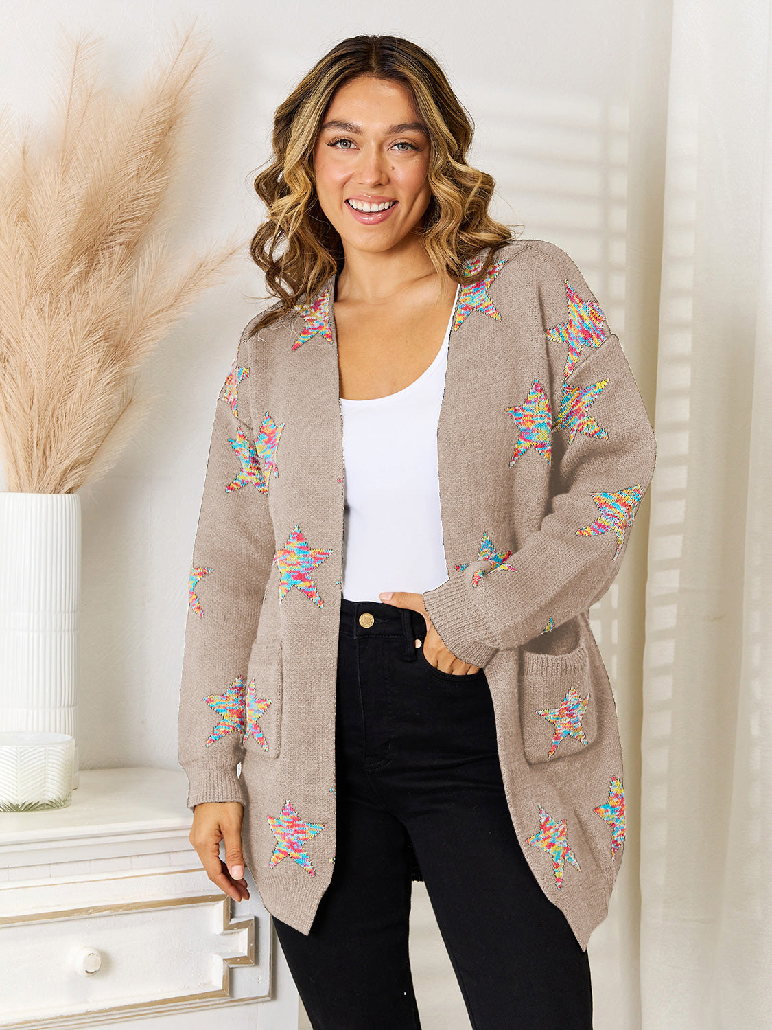 Khaki acrylic knit cardigan with colorful starburst pattern and pockets.