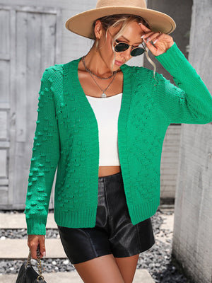 Green acrylic knit cardigan with textured sleeves and open front.