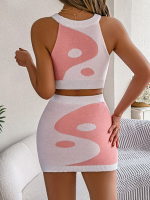Blush pink and white knit crop top and mini skirt set with a Yin Yang pattern.