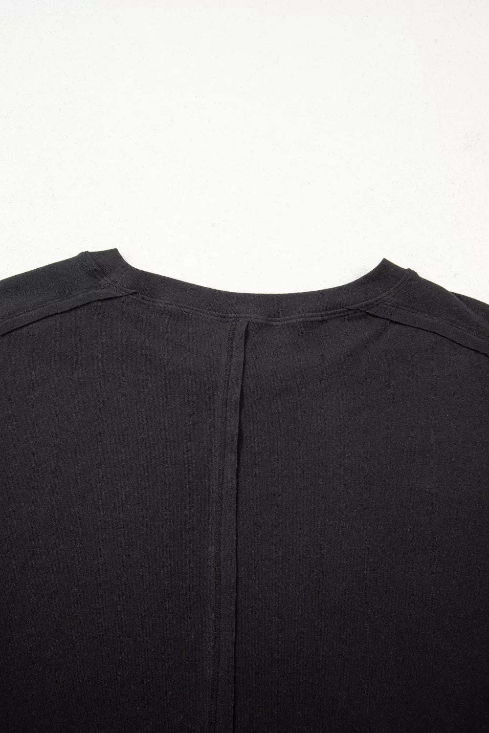 Black maternity t-shirt with lace detail and relaxed fit, featuring a seam detail on the back.