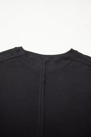 Black maternity t-shirt with lace detail and relaxed fit, featuring a seam detail on the back.