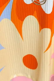 Retro floral ribbed blouse with large cream and orange flower print.
