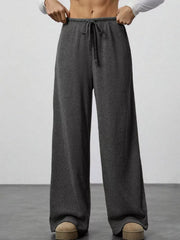 Dark gray ribbed wide-leg pants with drawstring waist and pockets.