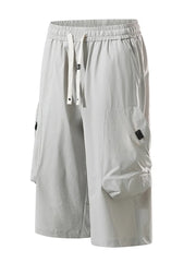 Light gray cargo capris with adjustable drawstring and large side pockets.