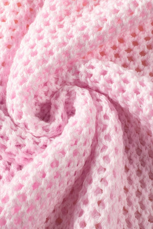 Openwork floral intarsia sweater in blush pink acrylic with a delicate, airy knit texture.