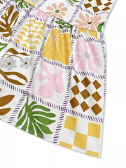 Vibrant cutout back cami dress with a patchwork floral and geometric print.