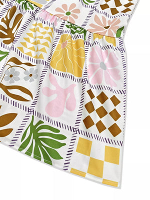 Vibrant cutout back cami dress with a patchwork floral and geometric print.