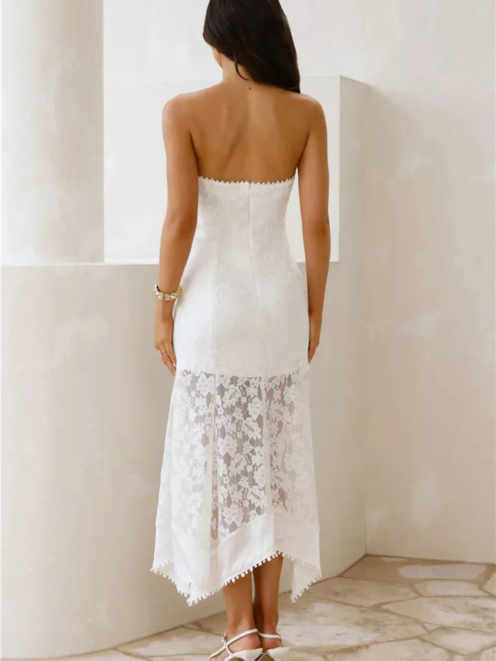 White lace strapless midi dress with floral overlay and scalloped hem