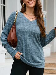 Blue textured V-neck knit long-sleeve top with ribbed detail.