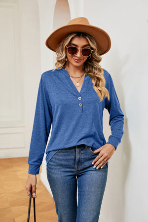 Henley-inspired long sleeve top in cerulean blue with a buttoned V-neck and casual fit.