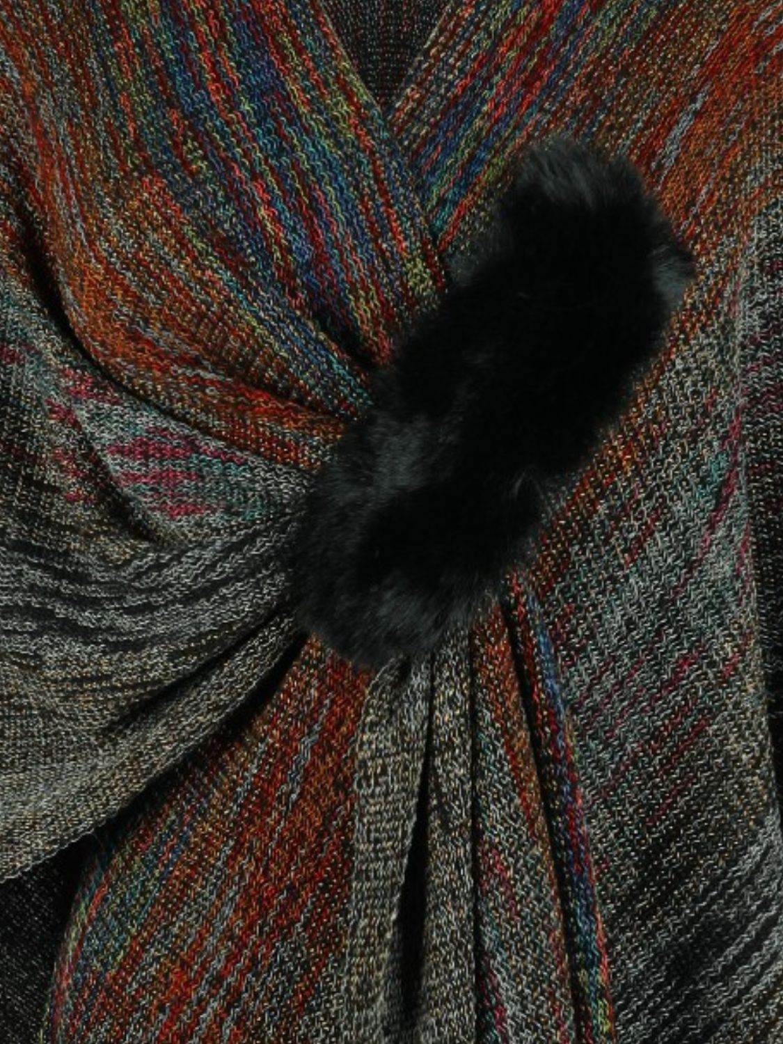 Knit wrap coat with multicolor stripes and black pom-pom detail.