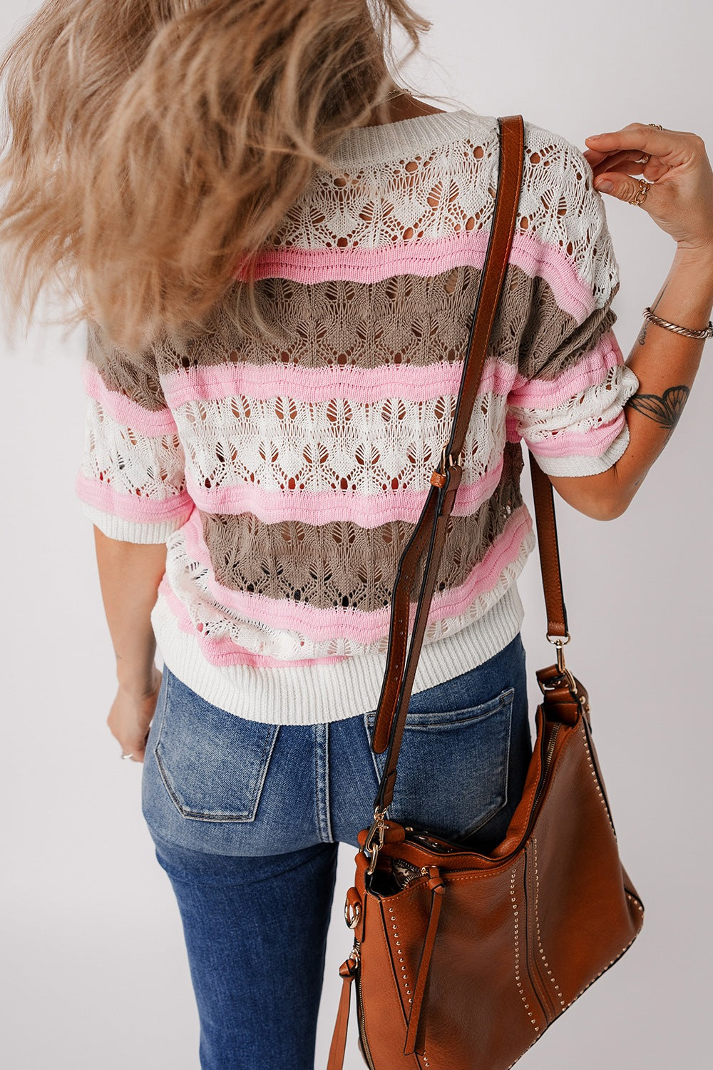 Striped openwork knit top with pink, taupe, and white stripes.