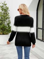 Black ribbed sweater with white horizontal stripe detail on sleeves and torso.