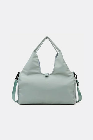Dusty Blue duffel bag with dual handles and adjustable shoulder strap