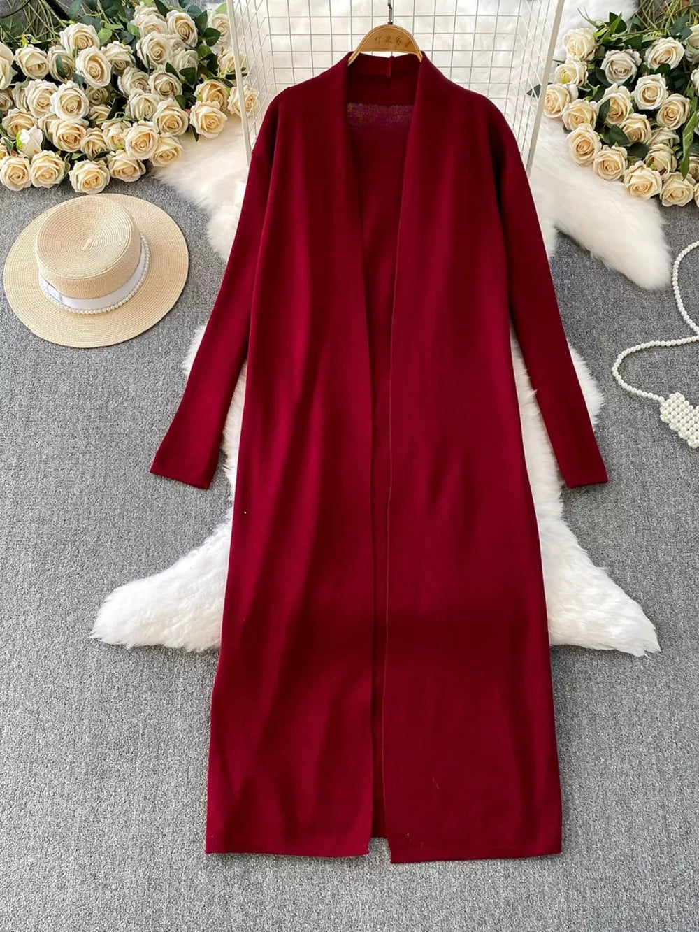 Burgundy knitted maxi dress and open front cardigan ensemble with long sleeves.
